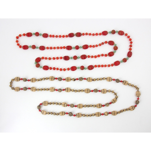 116 - An early 20th century Max Neiger necklace, the twenty 'scarab beetle' designed red beads with spheri... 