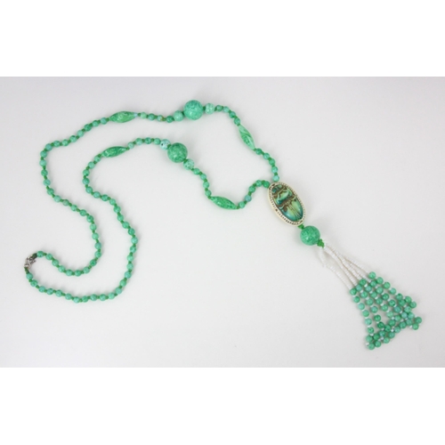 117 - A 20th century Max Neiger style necklace, the mottled green glass beads with spherical and torpedo s... 