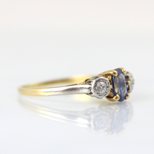 123 - An early 20th century untested sapphire and diamond three stone ring, the central oval cut untested ... 