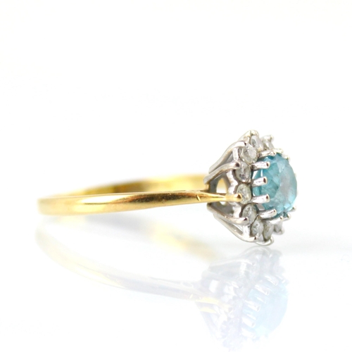 126 - An Edwardian style 18ct yellow gold blue zircon and diamond cluster ring, the round cut blue zircon ... 