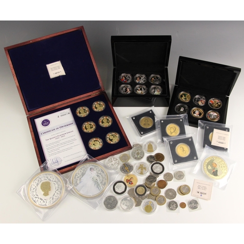 139 - A collection of gold, silver and gold plated coins, to include a 1/8oz gold 50 Francs 50 Years Inves... 