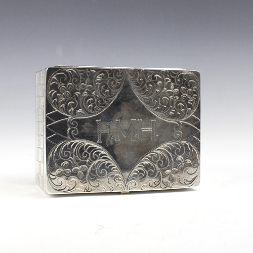 15 - An East African white metal jewellery box, the rectangular hinged cover with florally engraved decor... 