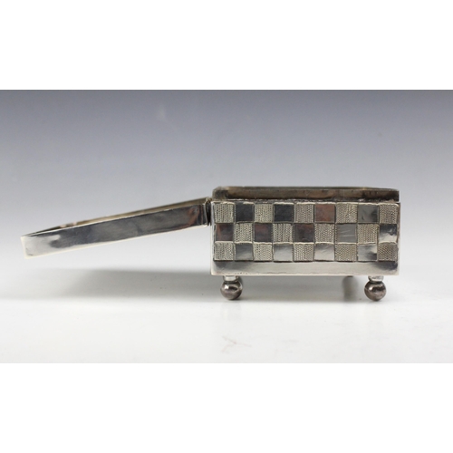 15 - An East African white metal jewellery box, the rectangular hinged cover with florally engraved decor... 