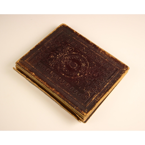 224 - A common place book, mid 19th century, in full tooled leather binding, containing hand-written trans... 