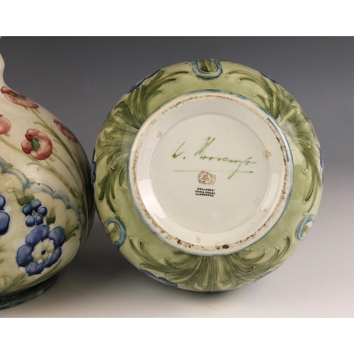 250 - A pair of William Moorcroft for James Macintyre & Co. Florian ware vases, retailed by Hollands of Ll... 