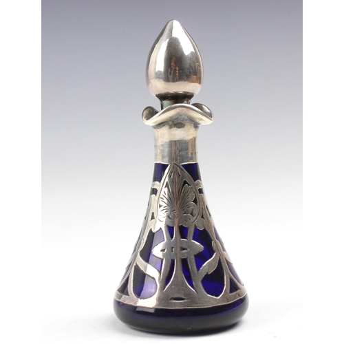 26 - An Edwardian silver and glass scent bottle, possibly Henry Herbert Friend, the tear drop shaped stop... 