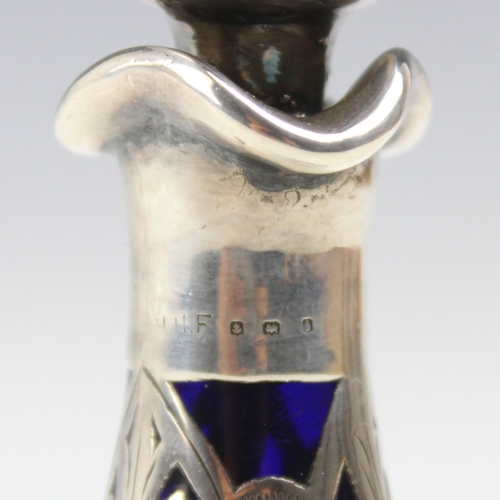 26 - An Edwardian silver and glass scent bottle, possibly Henry Herbert Friend, the tear drop shaped stop... 