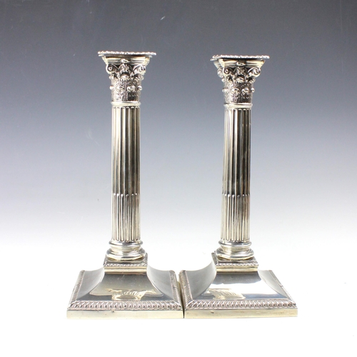 27 - A pair of George V silver candlesticks, Thomas Bradbury & Sons Ltd, Sheffield 1921, the removeable d... 