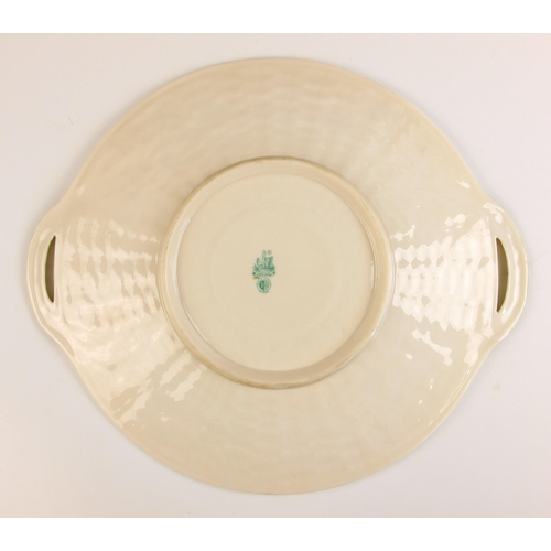 294 - A Belleek porcelain part tea service in the Shamrock pattern, mid 20th century, comprising: six teac... 