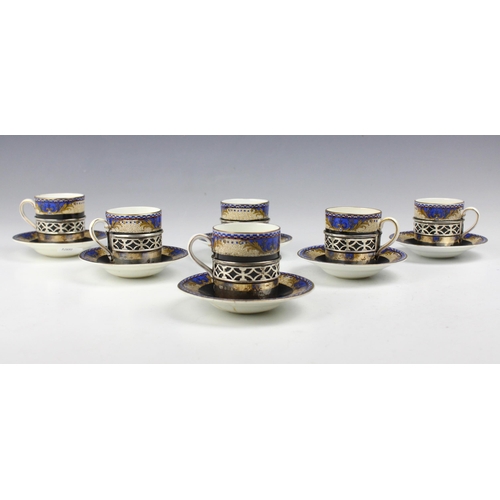 30 - A set of six George V silver mounted coffee cans and saucers, William Davenport, Birmingham possibly... 