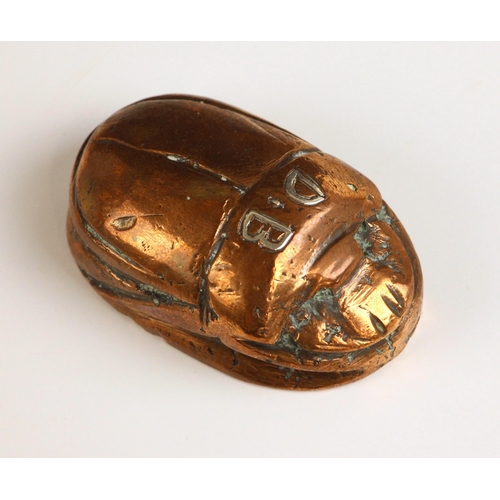 146 - A polished bronze model of a scarab beetle, probably early 20th century, the back with incised and w... 