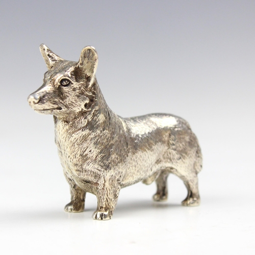 40 - A silver model of a Corgi, Edward Barnard and Sons Ltd, London 1975, the dog modelled standing with ... 