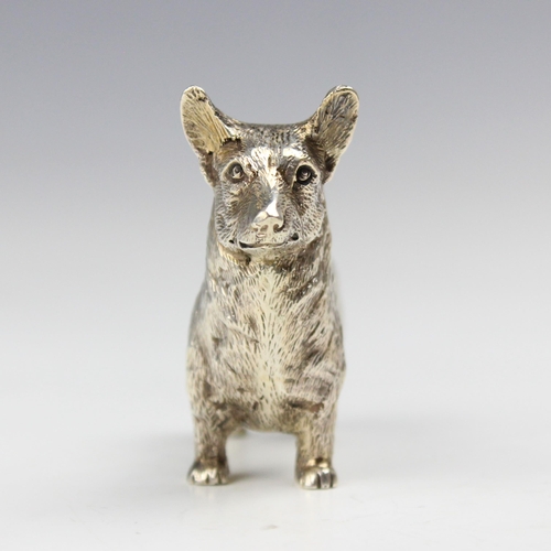 40 - A silver model of a Corgi, Edward Barnard and Sons Ltd, London 1975, the dog modelled standing with ... 