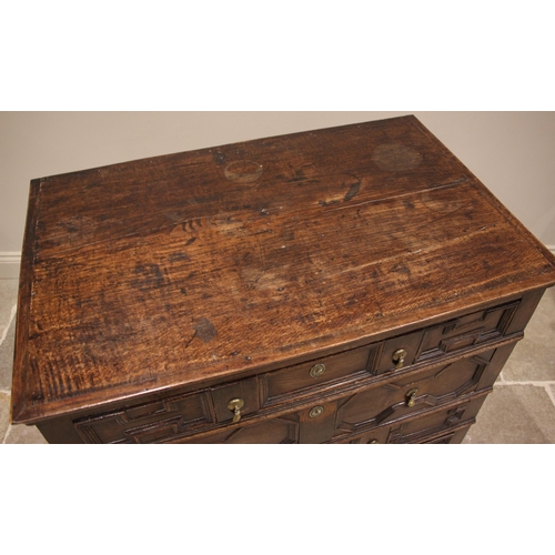 428 - A Jacobean geometric moulded oak chest of drawers, 17th century and later, formed with four long dra... 