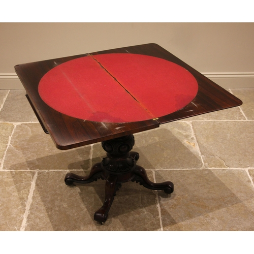 464 - A William IV rosewood card table, the rounded and moulded hinged rectangular top opening to a circul... 