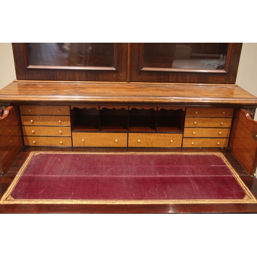 465 - A William IV rosewood secretaire library bookcase, the cavetto cornice over a pair of glazed doors a... 