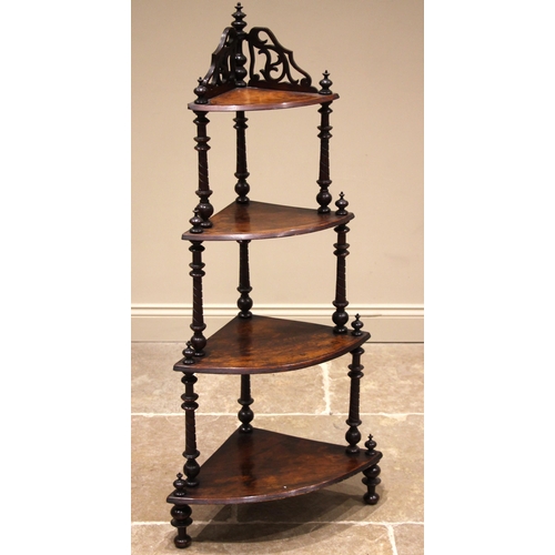 471 - A Victorian walnut corner whatnot, formed with four graduated bow front tiers, the upper tier with a... 