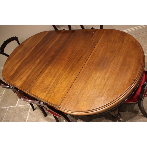 472 - A Victorian mahogany extending dining table, the circular moulded top upon lobed baluster legs and c... 