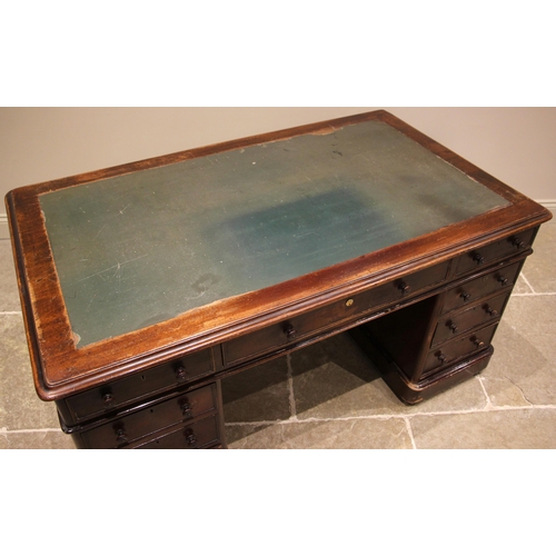 477 - A Victorian mahogany twin pedestal desk, the moulded rectangular top with rounded corners and inset ... 