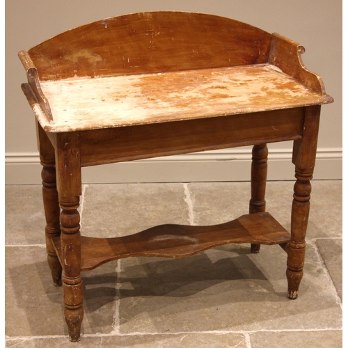 488 - A Victorian stained pine tray top washstand, upon baluster turned legs extending to peg feet, united... 