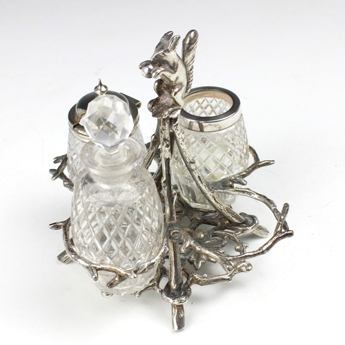 49 - A Mappin and Webb silver plated novelty cruet stand, the squirrel modelled finial above a branch des... 