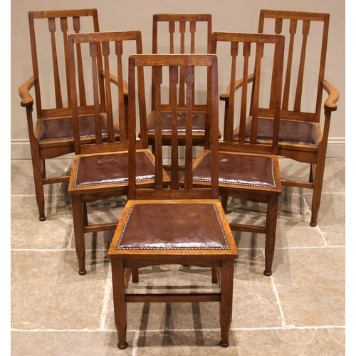 500 - A set of six golden oak Arts and Crafts style dining chairs, early 20th century, each with an angula... 