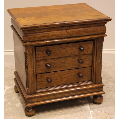 507 - A contemporary Dutch style stained hardwood chest of drawers, late 20th century, formed with a cushi... 