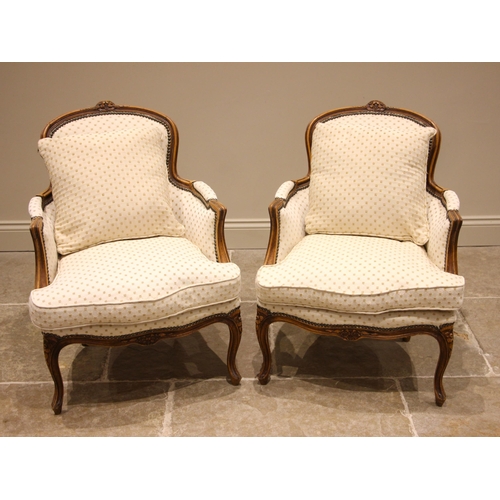 510 - Pair of Louis XV style fauteuils armchairs, late 20th century, each with a carved stained beechwood ... 