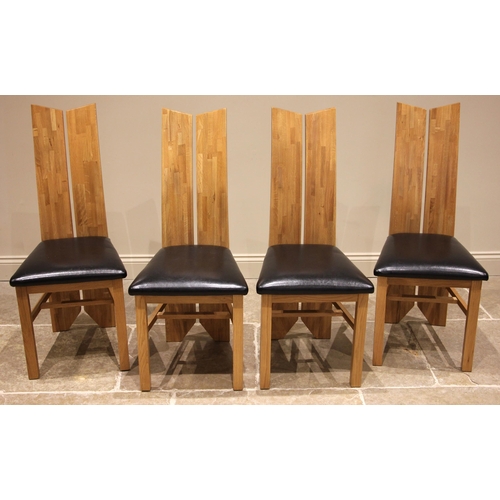 518 - A set of four contemporary light oak and leather dining chairs, each with a full length 'split' boar... 