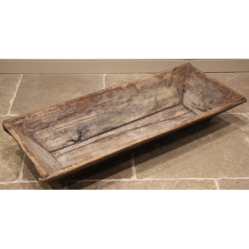 527 - A rustic wooden feed trough or dough bin, probably olive wood, late 19th/early 20th century, of typi... 