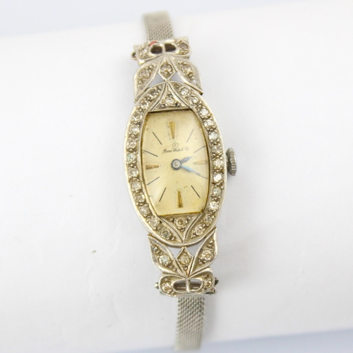 60 - An early 20th century 'Home Watch Co' diamond cocktail watch, the cream tonneau shaped dial with bat... 