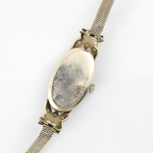 60 - An early 20th century 'Home Watch Co' diamond cocktail watch, the cream tonneau shaped dial with bat... 