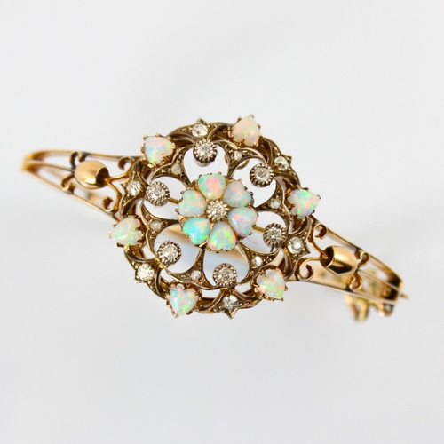 67 - A late 19th century diamond and opal pendant (converting to a bangle) the central six heart shaped o... 