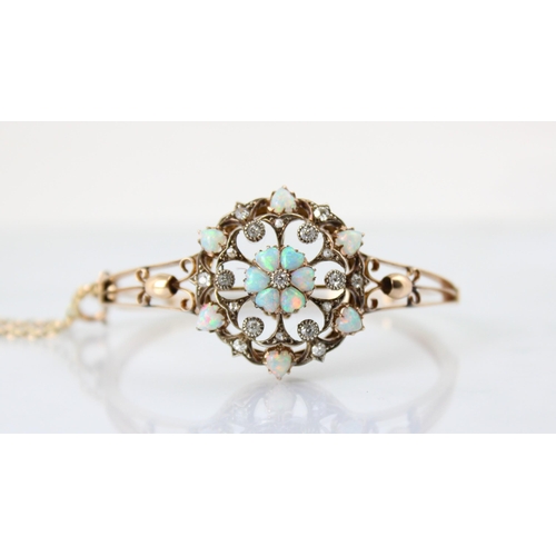 67 - A late 19th century diamond and opal pendant (converting to a bangle) the central six heart shaped o... 