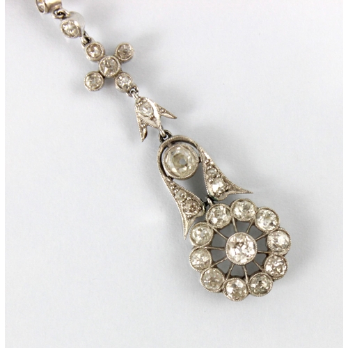 68 - A pair of early 20th century diamond drop earrings, the stylised flowerhead set with eleven round cu... 