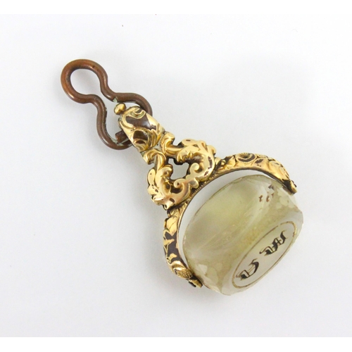 72 - A 19th century style untested citrine spinning fob, the gold plated openwork mount with carved detai... 