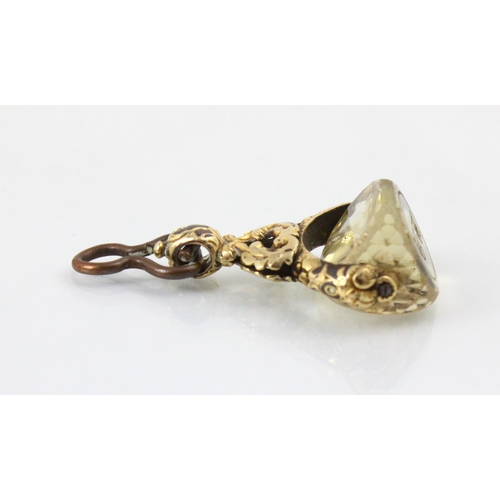 72 - A 19th century style untested citrine spinning fob, the gold plated openwork mount with carved detai... 