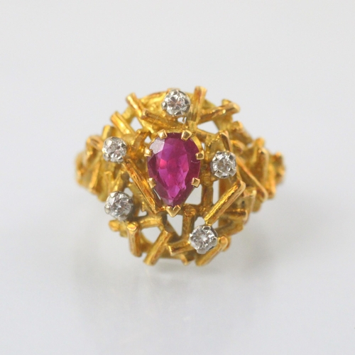 77 - A modernist certified Burmese ruby and diamond ring, in George Weil style, the central pear shaped r... 