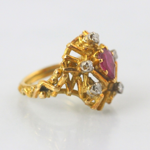 77 - A modernist certified Burmese ruby and diamond ring, in George Weil style, the central pear shaped r... 