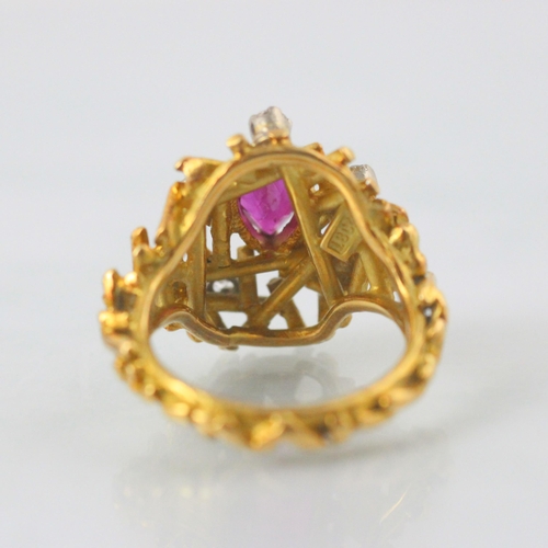 77 - A modernist certified Burmese ruby and diamond ring, in George Weil style, the central pear shaped r... 