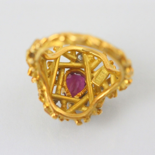 77 - A modernist certified Burmese ruby and diamond ring, in George Weil style, the central pear shaped r... 