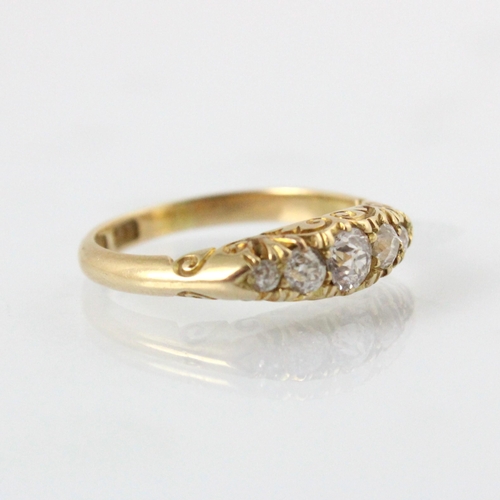 78 - A late 19th century diamond five stone ring, the five graduated old cut diamonds within yellow metal... 