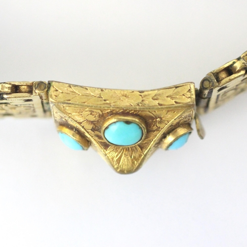 84 - A Victorian style gold plated bracelet, the raised rectangular box clasp set with four turquoise col... 