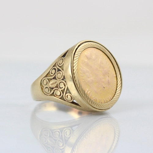 89 - A Russian coin mounted dress ring, the '10 rubels' coin within stylised openwork shoulders and plain... 