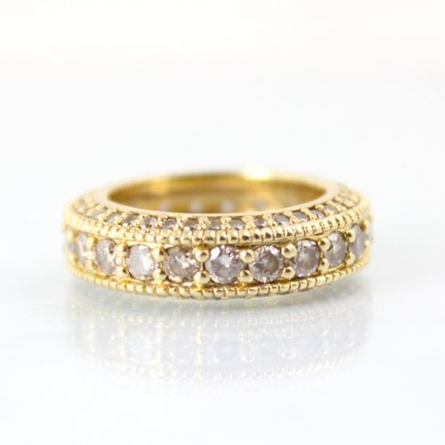 91 - A yellow metal mounted full diamond eternity ring, the twenty three round cut diamonds with smaller ... 