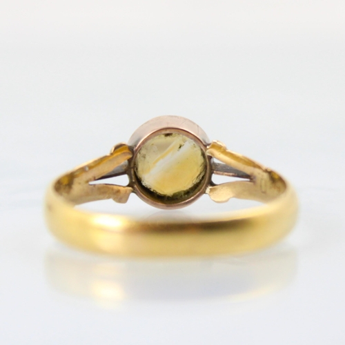 92 - A 22ct yellow gold wedding band, converted to a citrine set dress ring, the circular cut citrine wit... 