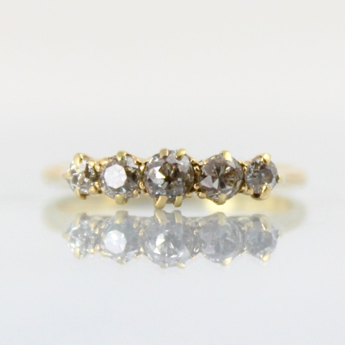 98 - An early 20th century diamond five stone ring, the five graduated old cut diamonds within claw set s... 