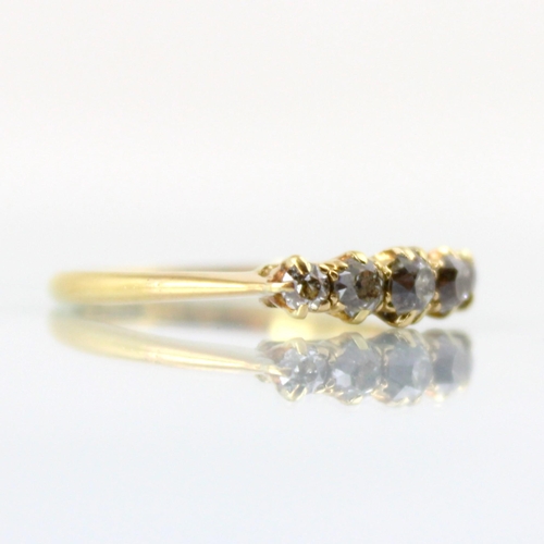 98 - An early 20th century diamond five stone ring, the five graduated old cut diamonds within claw set s... 