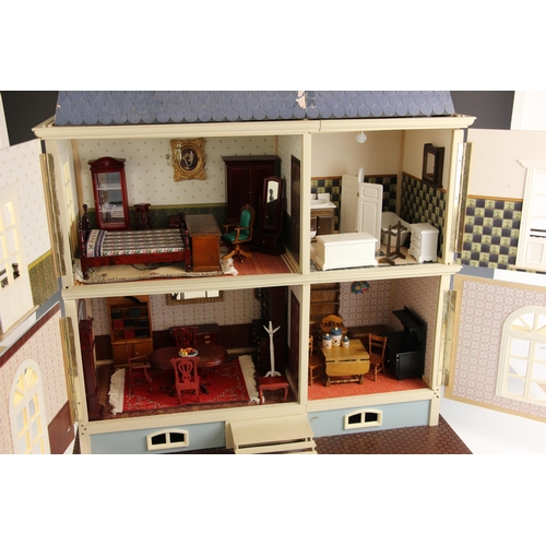 363 - A dolls house, late 20th century, modelled as a three storey French style country house, the frontag... 