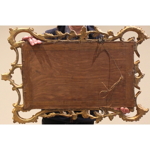 453 - A George III giltwood wall mirror, the rectangular mirrored plate set within a 'C' scroll and foliat... 